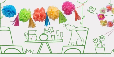 Un chien assis à table avec des flûtes à champagne, une vase, une carafe, et des pompons sur une ficelle au-dessus.